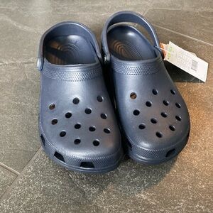 Navy Blue Crocs. Brand new with tags. Mens size 7 women’s size 9